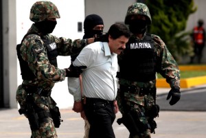 Mexican naval police take drug kingpin Joaquin "El Chapo" Guzman into custody on February 22, 2014. © Jair Cabrera Torres/NurPhoto/Corbis