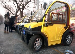 Small, electric cars, made in China, are displayed outside a showroom so potential customers can check them out in downtown Beijing on January 5, 2014. With auto sales booming across China, creating increasing traffic, parking and environmental problems, the electric car industry is taking off as Chinese look for alternatives for city commuting. UPI/Stephen Shaver