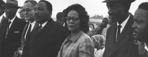 Portrait of Martin Luther King, Jr., with his wife Coretta Scott King and colleagues, during a civil rights march from Selma, Alabama, to the state capitol in Montgomery, on March 25, 1965. © William Lovelace/Express/Getty Images