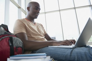 Student using laptop --- Image by © Rachel Frank/Corbis